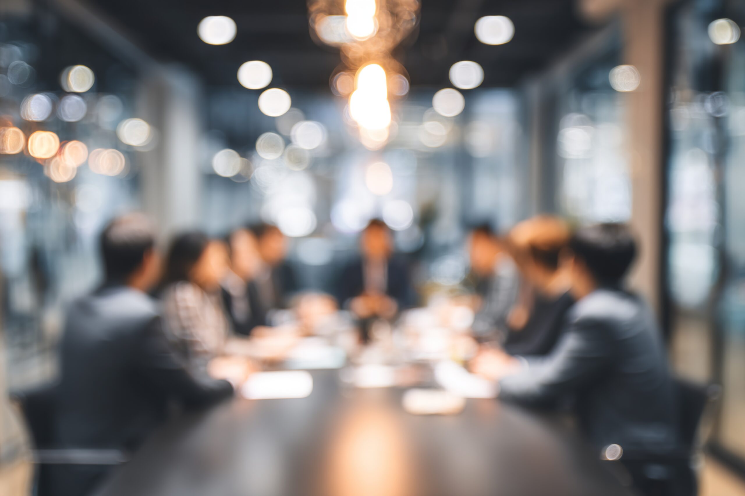 Blur office meeting blurred background with business people working group in boardroom discussion for teamwork brainstorming, executive seminar or professional training in small startup enterprise