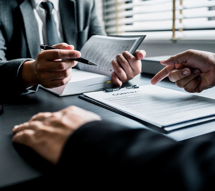Close up of businessmen or lawyers discussing contract or business agreement at law firm office, Business people making deal document legal, justice advice service concept.